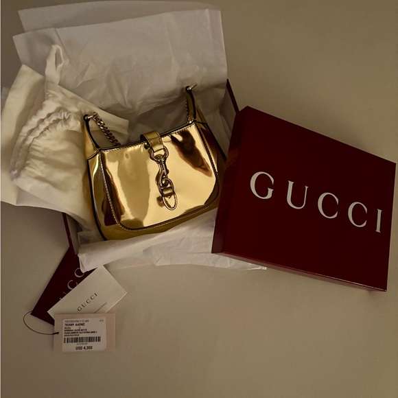 Gucci Handbags - Gucci Gold Mirrored Jackie Notte Bag